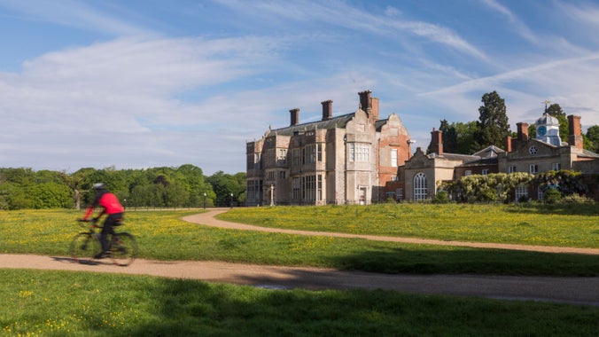 Cyclist at Felbrigg Hall, Gardens and Estate, Norfolk